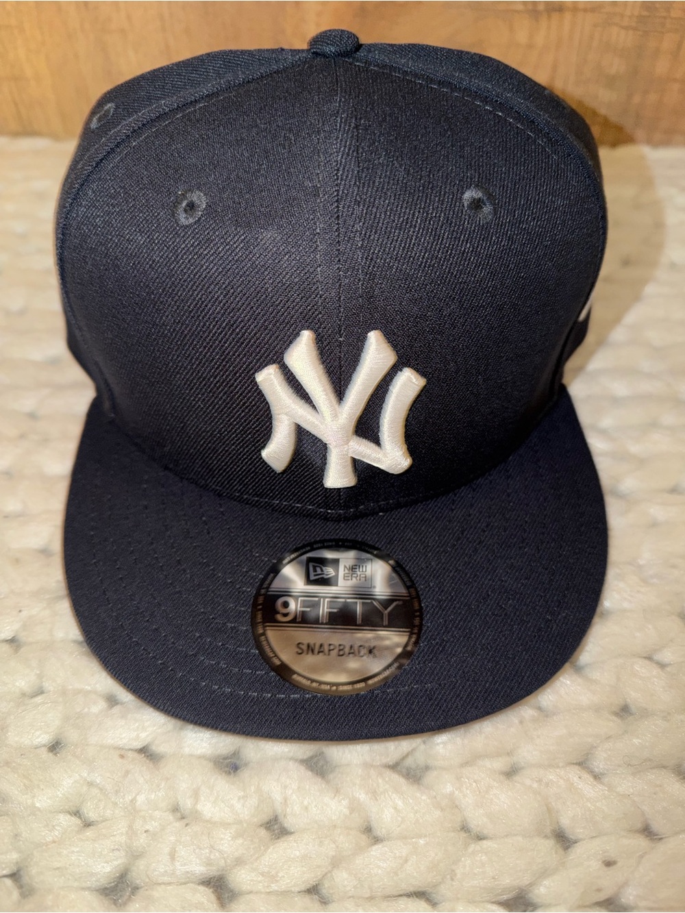 New Era Navy Snapback Cap with White Logo